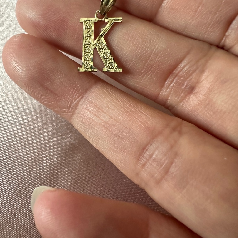 Ornate Gold 'K' Necklace with Sparkling Embellishments